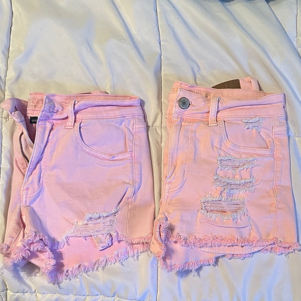 2 pair of pink distressed American Eagle shorts